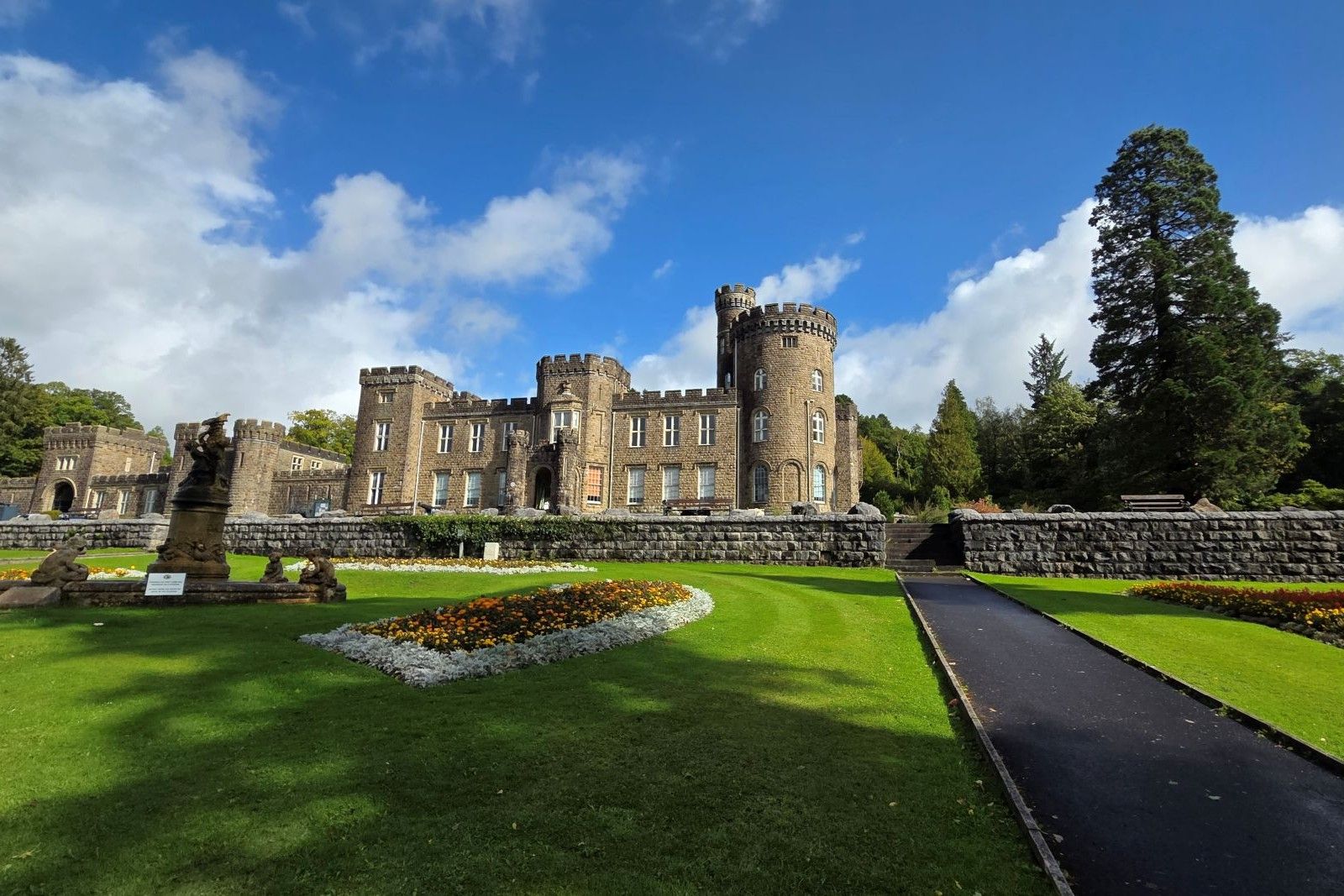 Cyfarthfa castle with fountain and flowers in the foreground..jpg