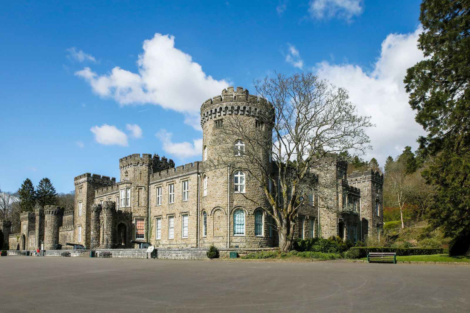 Cyfarthfa Castle with a blue sky and fluffy white clouds.jpg